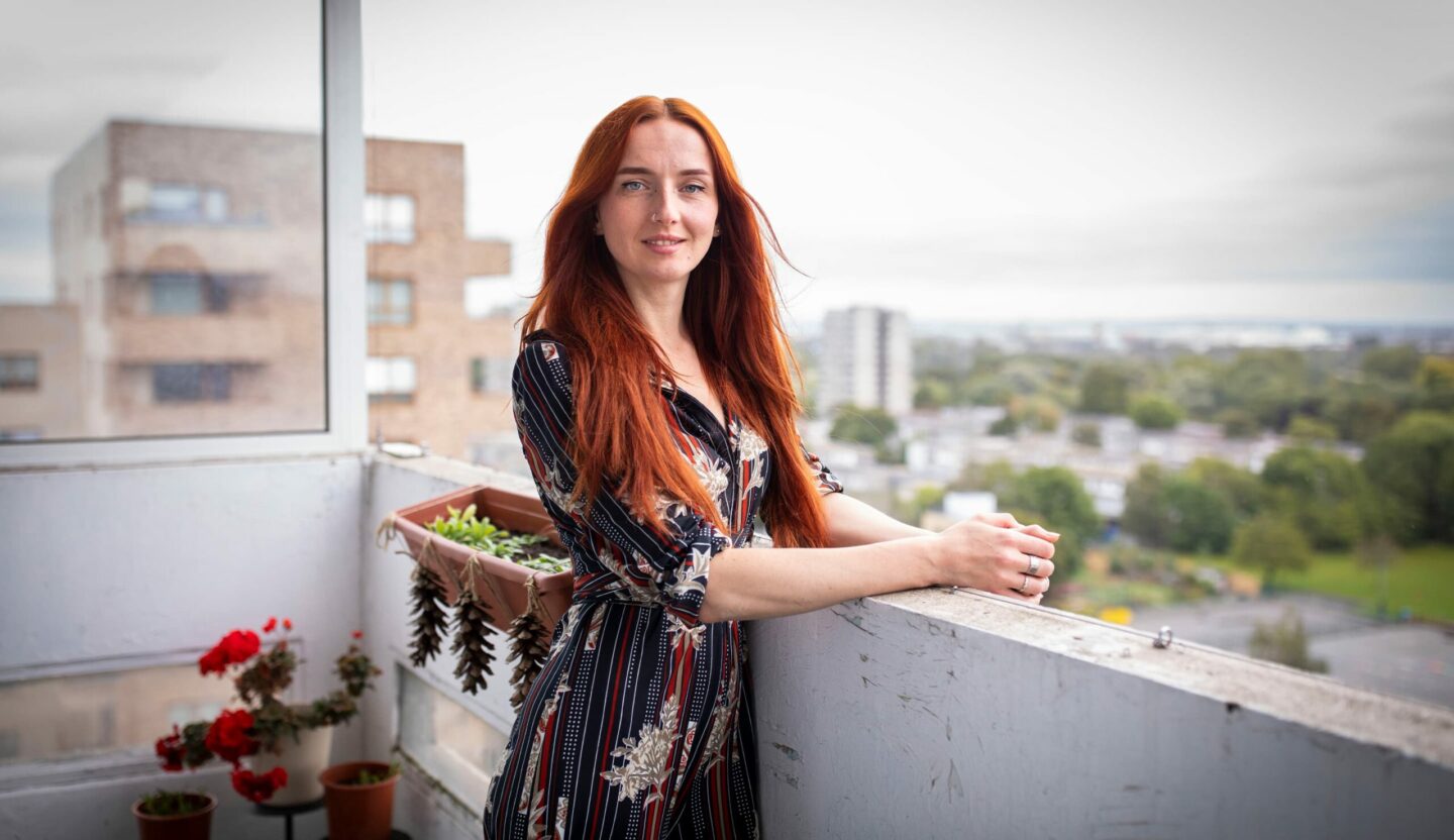 Property guardian standing on balcony