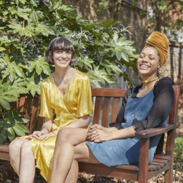 Two women sitting on a bench