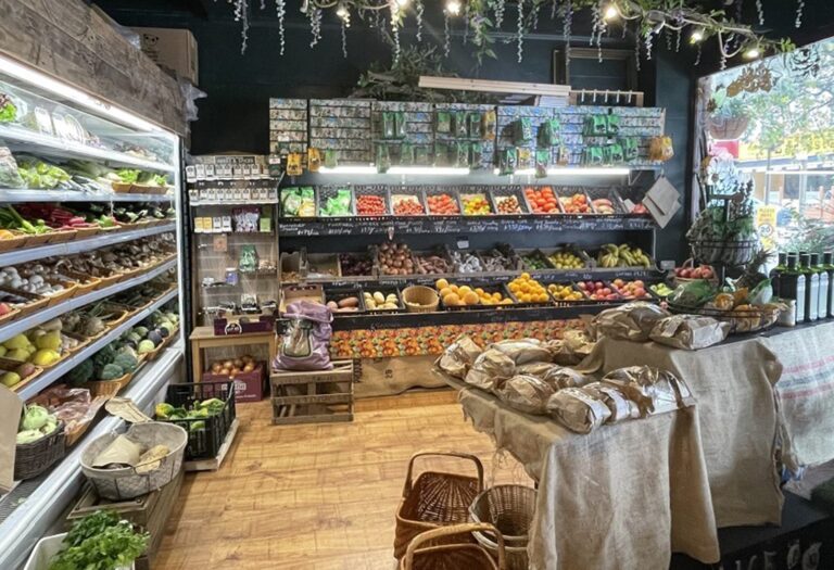 Shop shelves lined with fruit and vegetable
