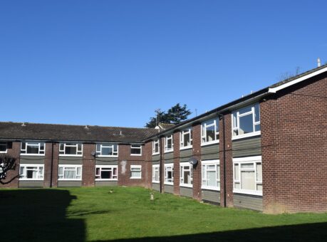 Low-rise flats in peaceful grass setting