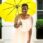 Guardian holding yellow umbrella.
