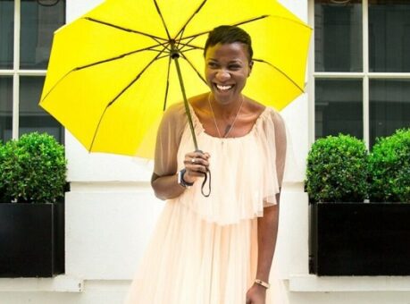 Guardian holding yellow umbrella.