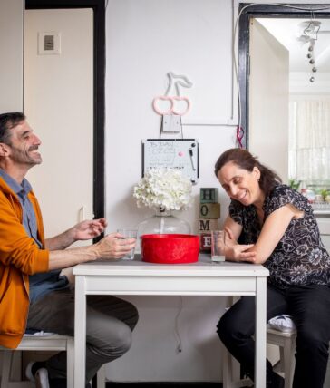 Header image of two guardians sitting at a table smiling.