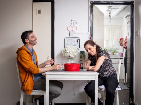 Header image of two guardians sitting at a table smiling.